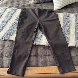 Michael Kors stretch black pants with slits on the bottom. Inseam 23.